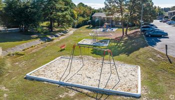 a playground in a park on a sunny day